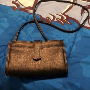 Buxton bag comes with a mirror and tiny wallet